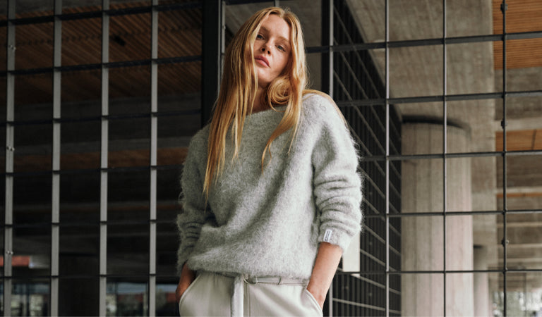 Shop the soft timeless knit sweater in light grey melee for women