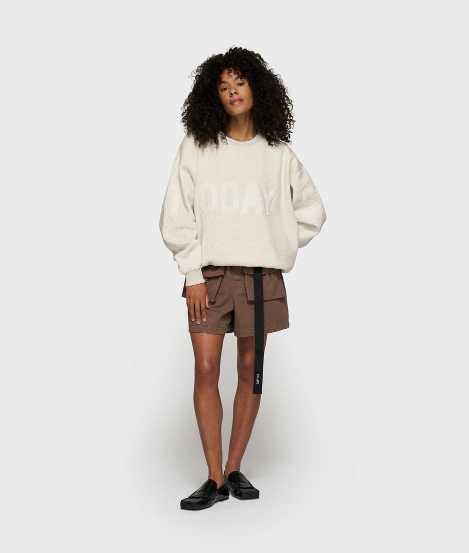 statement sweater logo patch | soft white melee