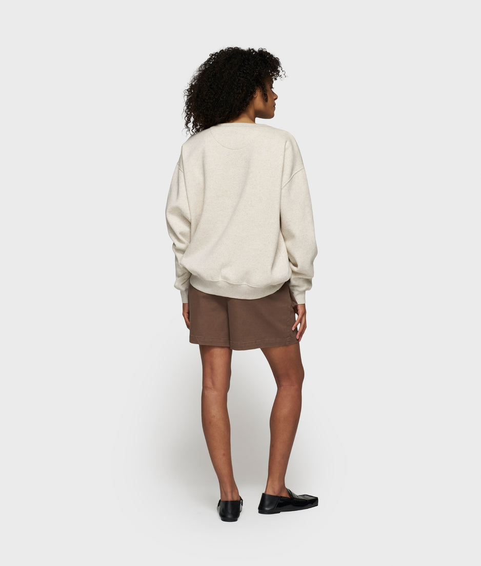 statement sweater logo patch | soft white melee