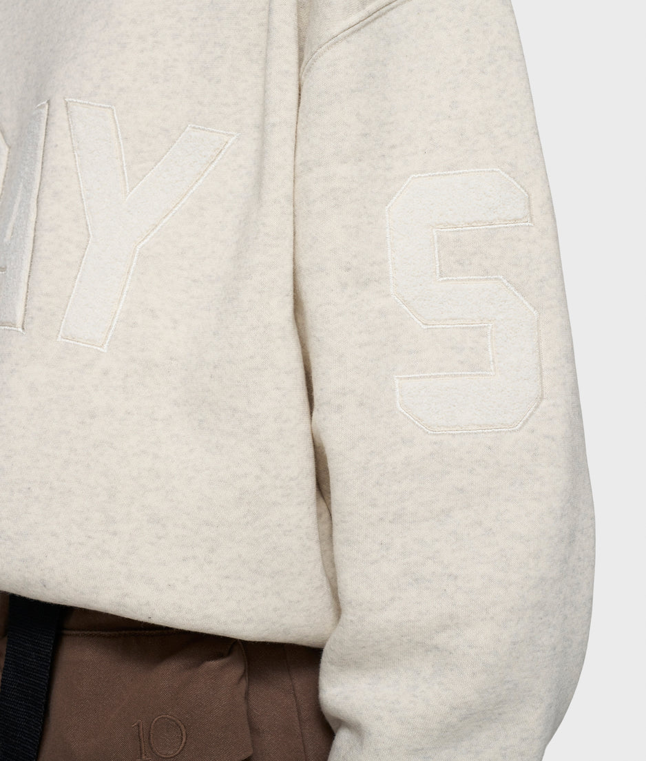 statement sweater logo patch | soft white melee