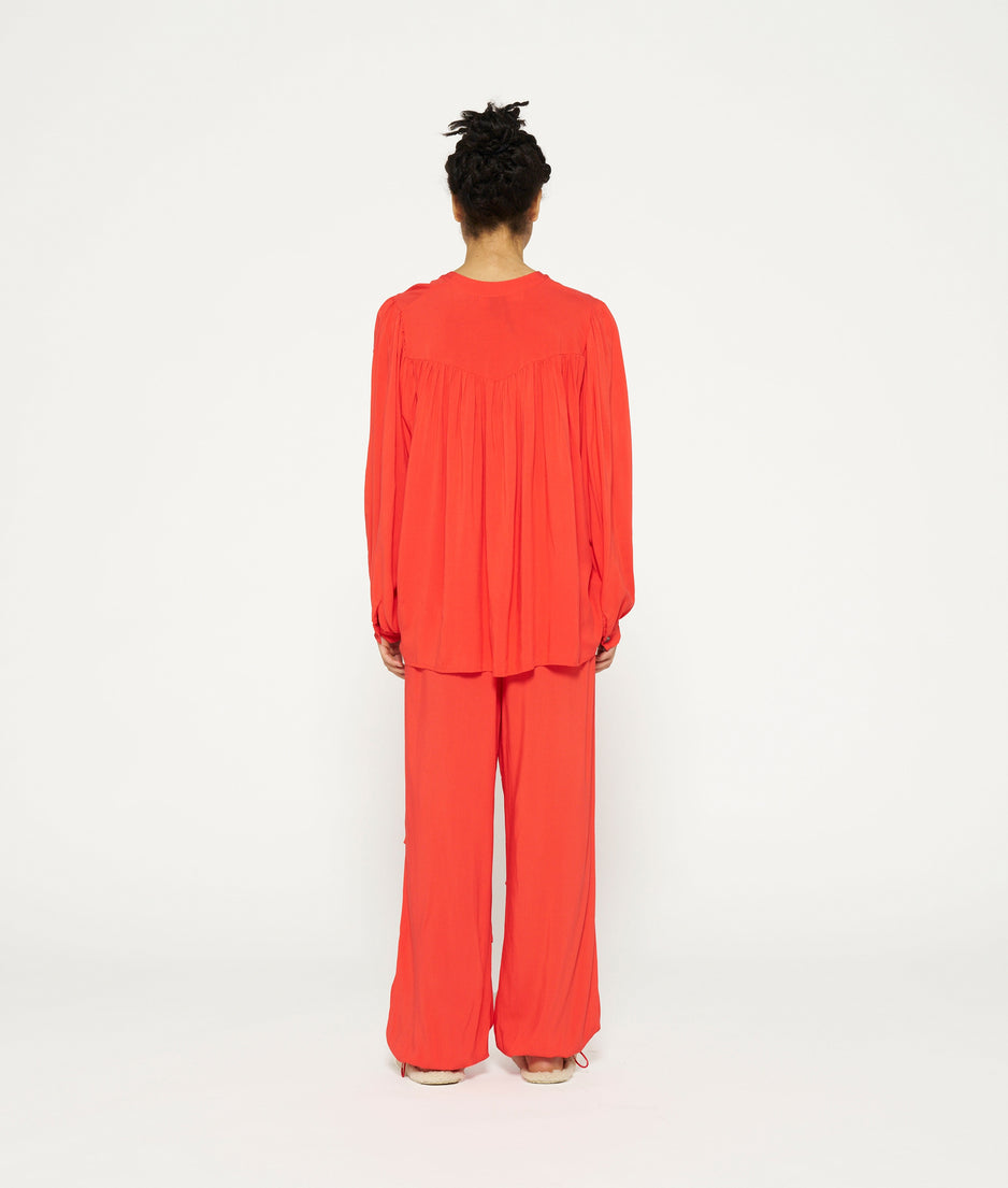 flowy pleated blouse | poppy red