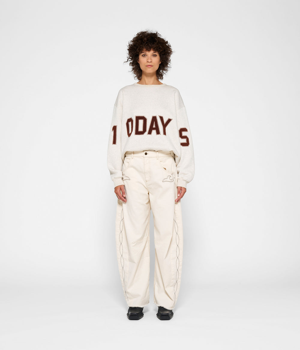 statement sweater logo | soft white melee