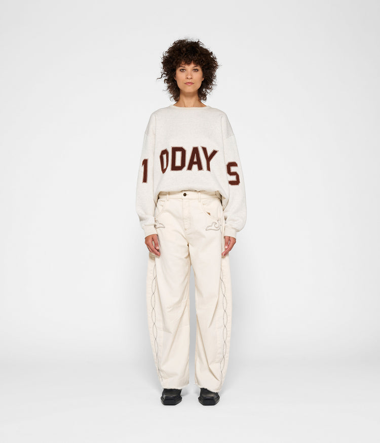 statement sweater logo | soft white melee