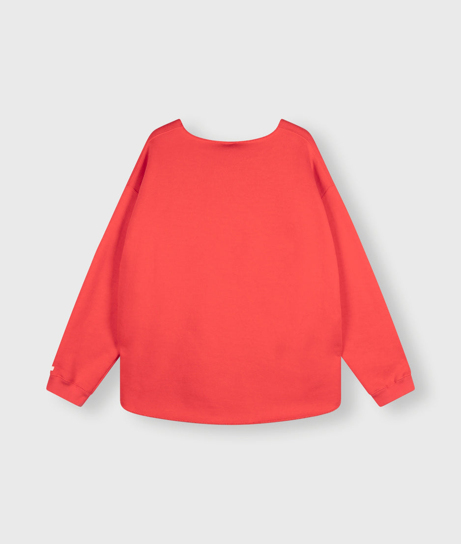 raw edge statement sweater | coral red