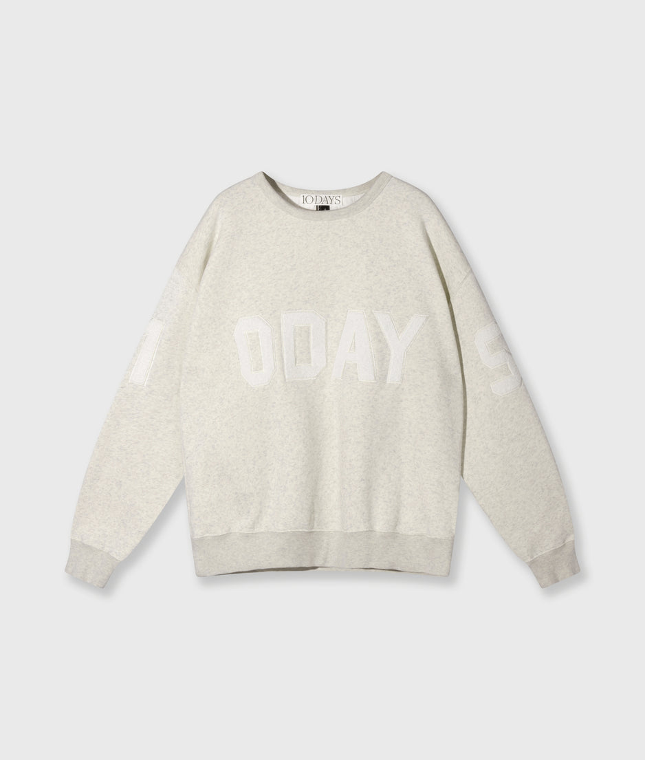 statement sweater logo patch | soft white melee