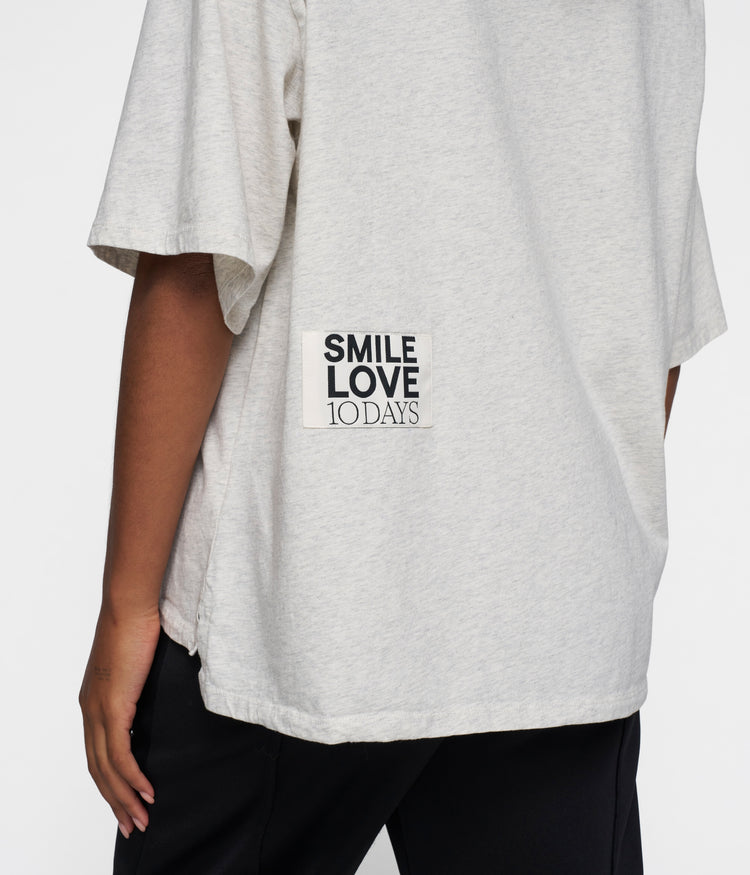 statement tee smile love | soft white melee