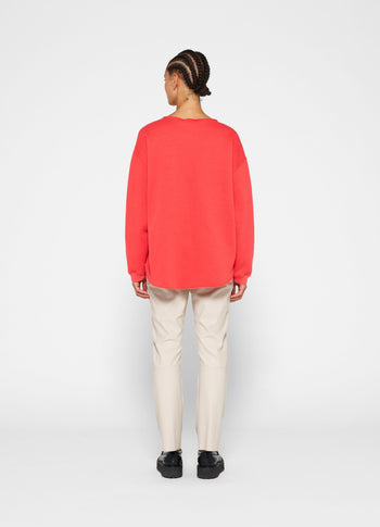 raw edge statement sweater | coral red