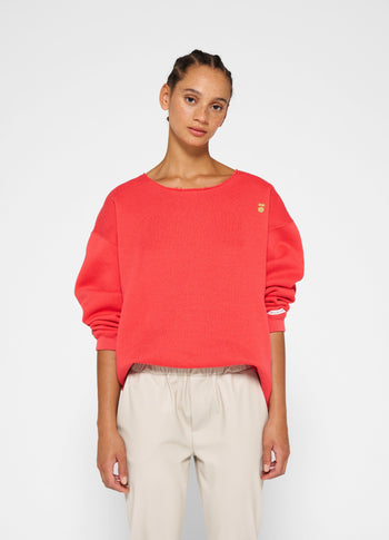 raw edge statement sweater | coral red