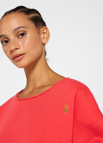 raw edge statement sweater | coral red
