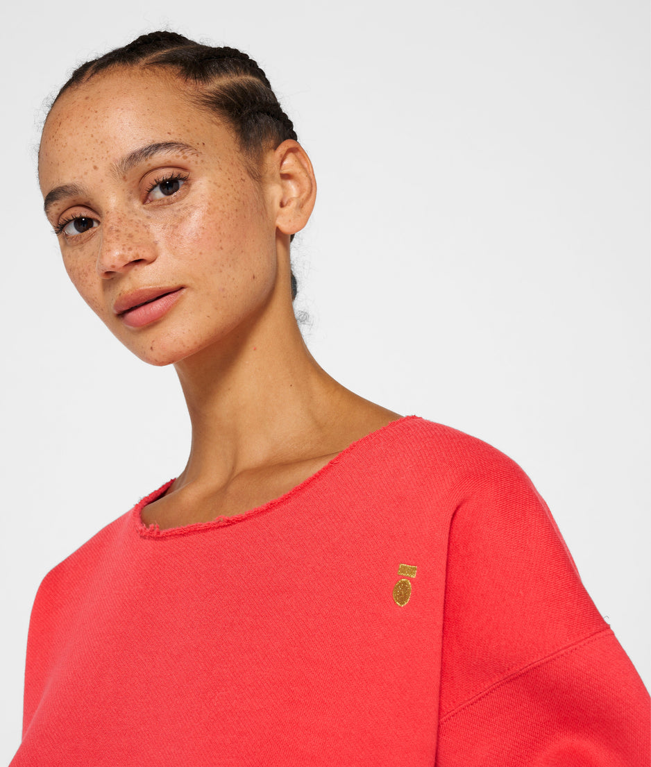 raw edge statement sweater | coral red