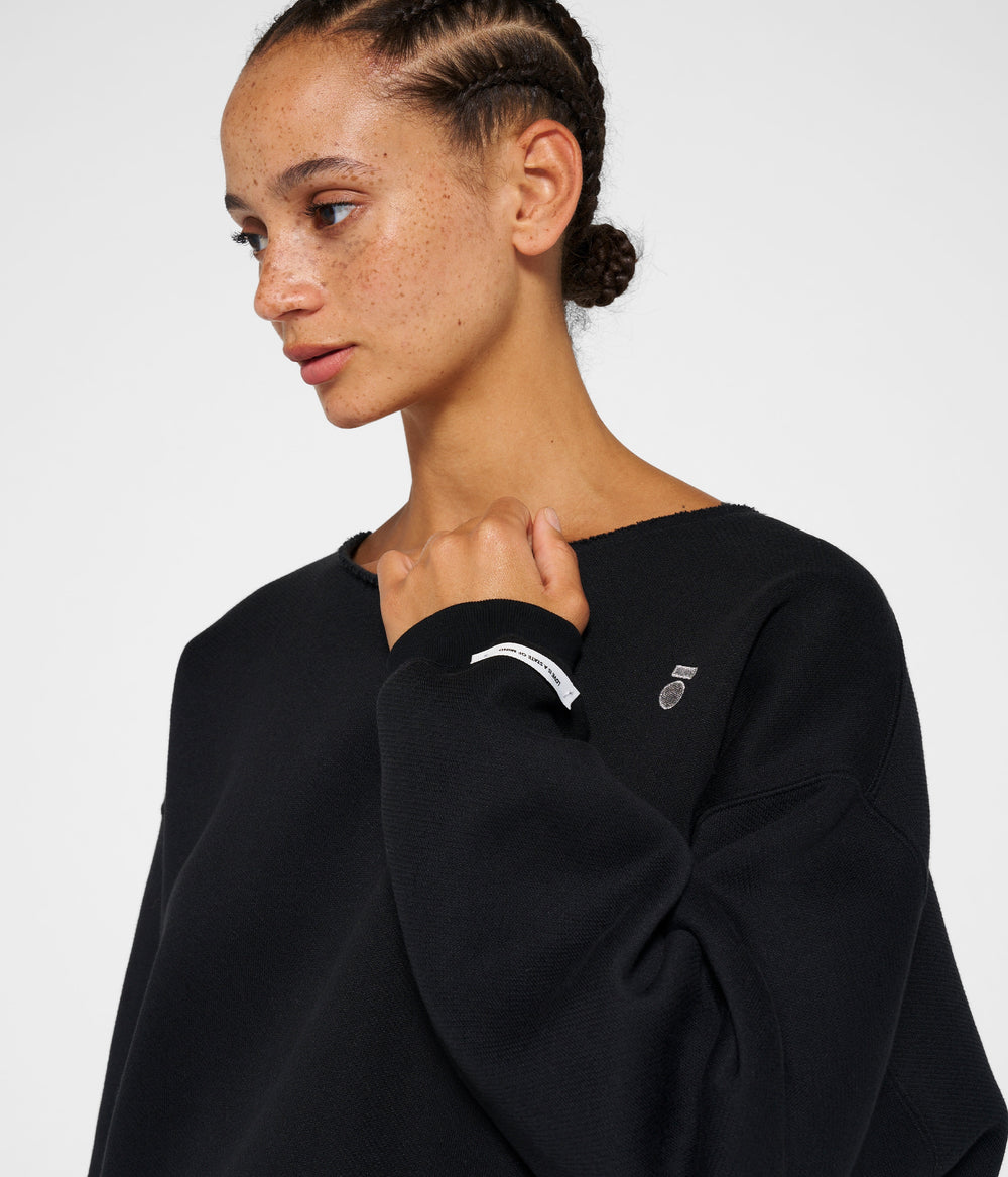 raw edge statement sweater | black